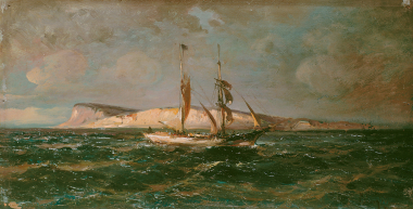 Caique sailing past rocks