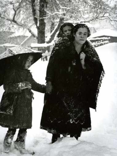 Carrying her children in winter
